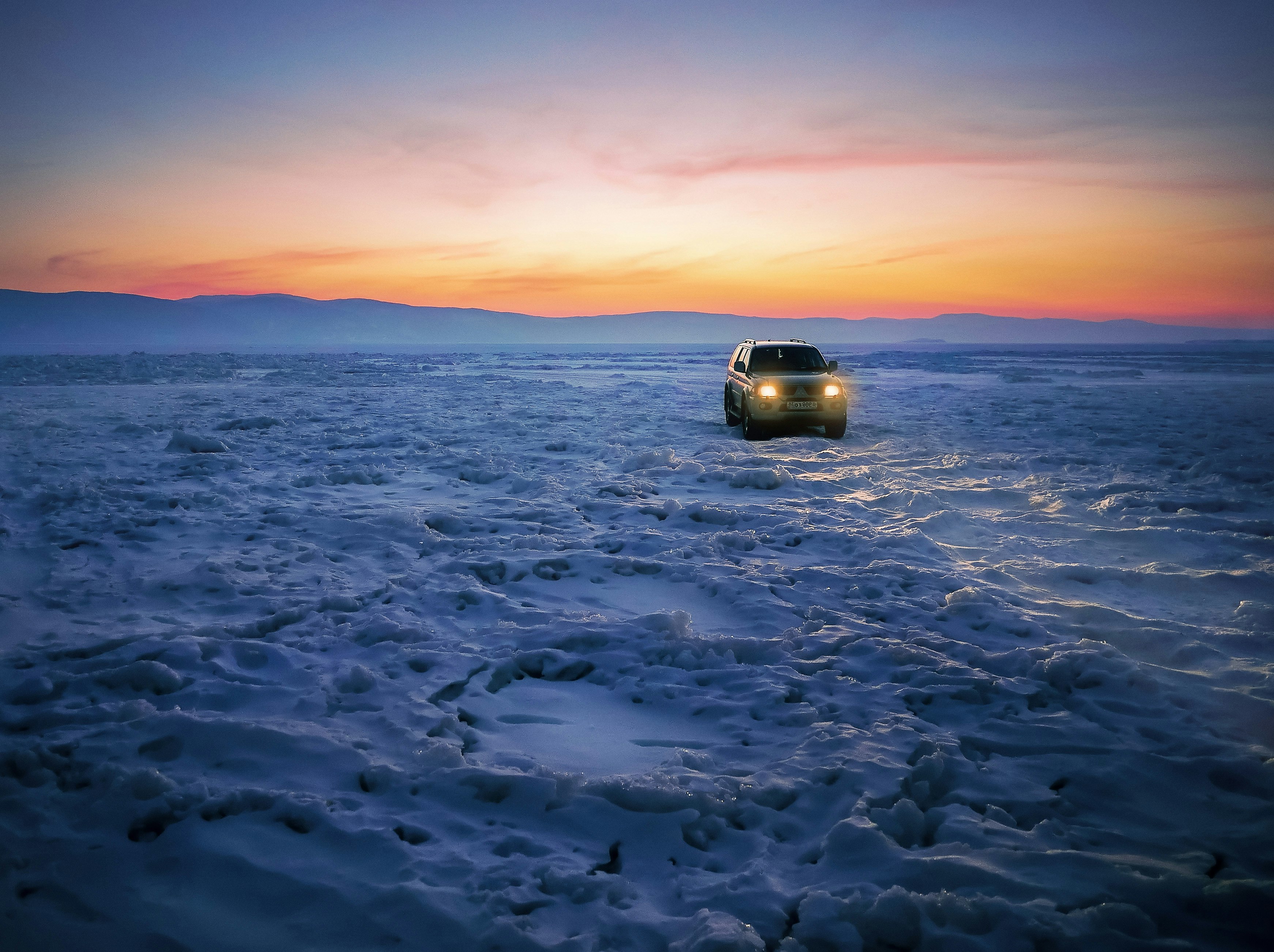 car on snow pavement